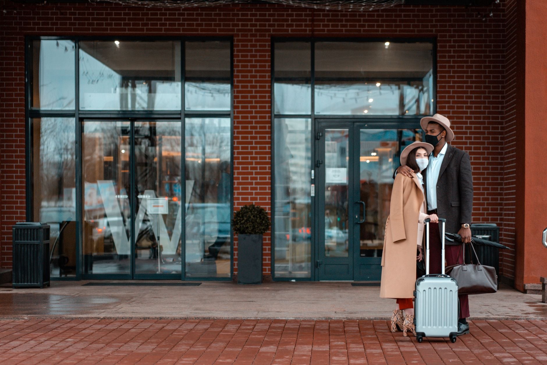 family arriving at hotel with luggage